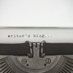 Top of a typewriter that says "writer's blog..."